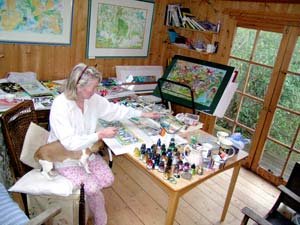 Jenny Dodd at work on a painting in her studio